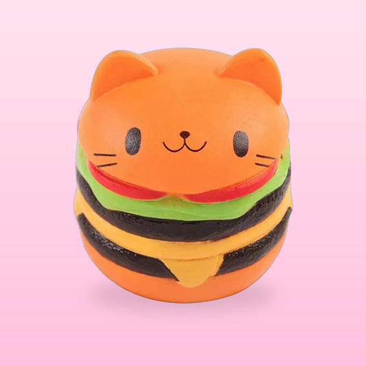 Orange cat face burger squishy stress toy, on a bubblegum pink background