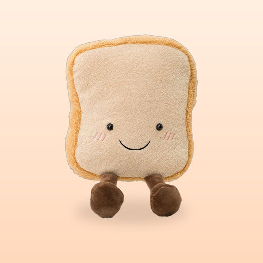 Smiling toast plush with rosy cheeks and little brown legs on a peach background