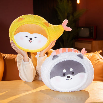 Two round plush cushions: one yellow smiling toy with a pink tail held up, and one white-gray fluffy face c...
