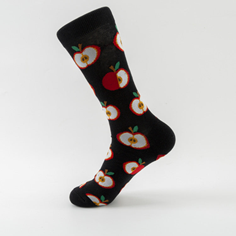 Single black crew sock with repeating red-and-white apple halves, green leaves and yellow cores.
