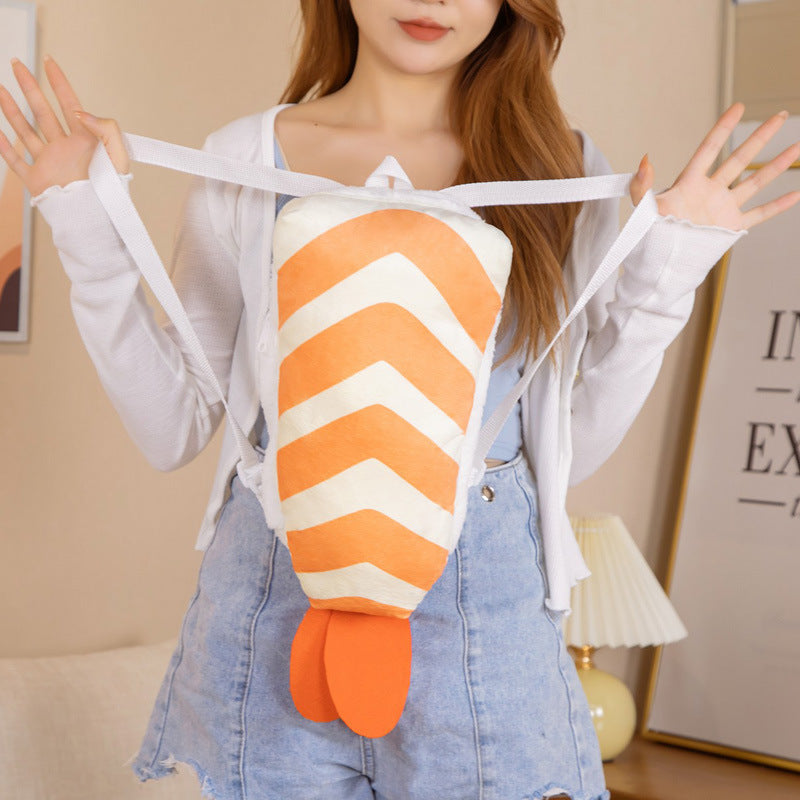 One orange-and-white chevron plush backpack with orange tail fins and white straps worn on a person.