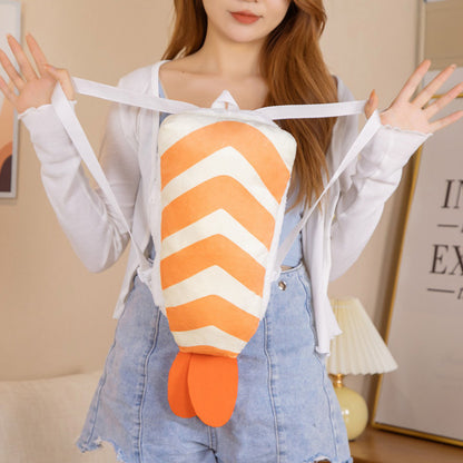 One orange-and-white chevron plush backpack with orange tail fins and white straps worn on a person.