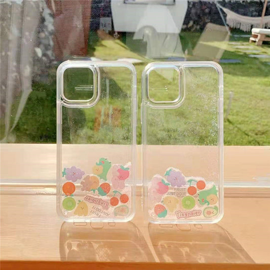 Two clear phone cases standing side-by-side, each with small pastel fruit and animal stickers along the bot...