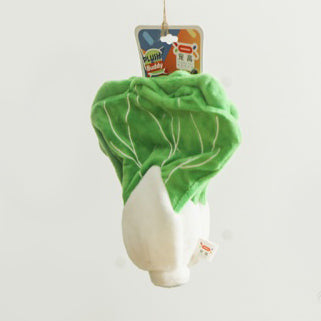 One green-and-white plush bok choy toy with stitched leaf veins and a hanging tag on a white background.
