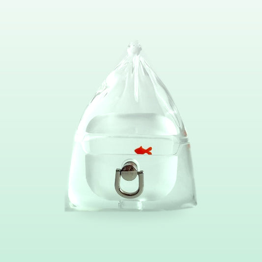 Clear goldfish in a bag AirPods case with a small orange fish and a silver ring loop, on a soft mint background
