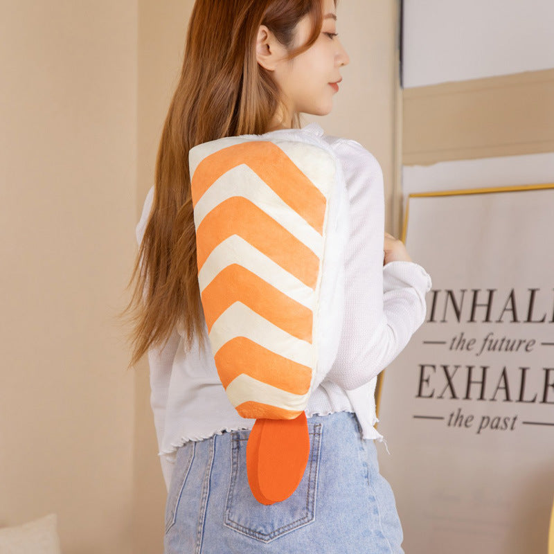 One plush orange-and-white striped backpack with orange tail flap and visible zipper, worn on woman's back.