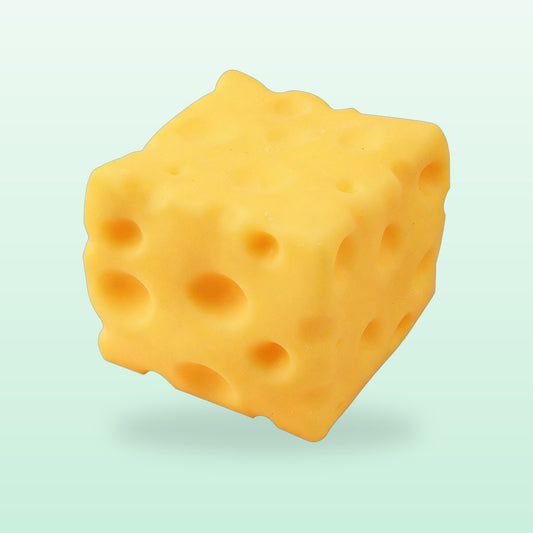 Cheese block squishy with holes, on a soft mint background