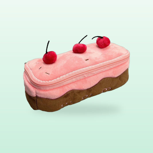 Pink cherry cake plush pencil case with three cherries on top, on a soft mint background