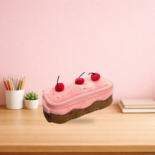 Cherry cake plush pencil case on a light oak desk