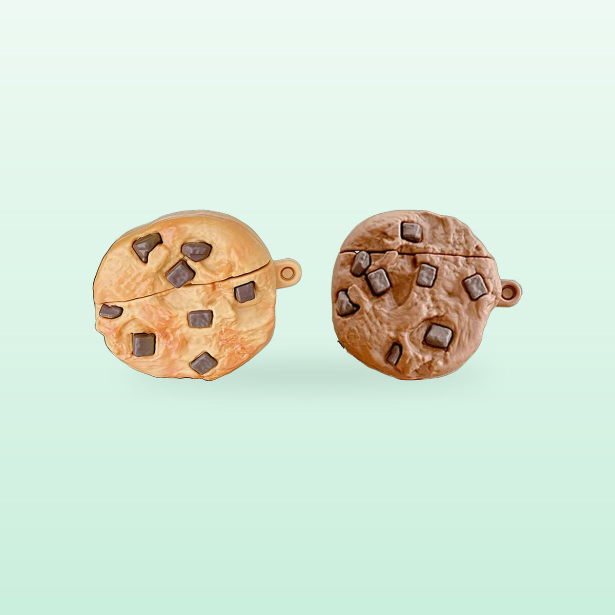 Choc chip cookie AirPods cases in golden and chocolate, side by side on a mint background