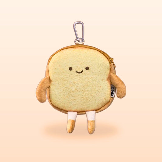 Happy Toast bread coin purse with a keyring clip, smiling face and little legs, on a soft peach background
