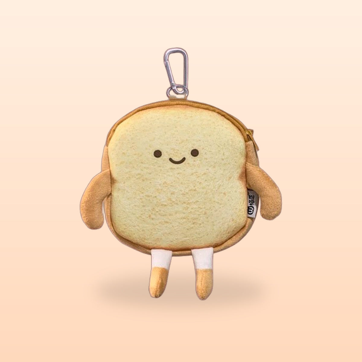 Happy Toast bread coin purse with a keyring clip, smiling face and little legs, on a soft peach background