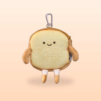 Happy Toast bread coin purse with a keyring clip, smiling face and little legs, on a soft peach background