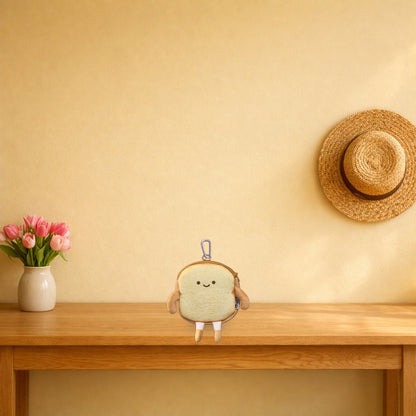 Happy Toast bread coin purse sitting on a light oak console table