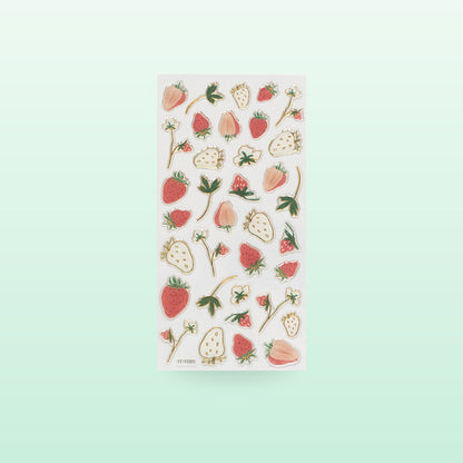 Strawberry metallic fruit sticker sheet with red and white berries and gold edges, on a soft mint background
