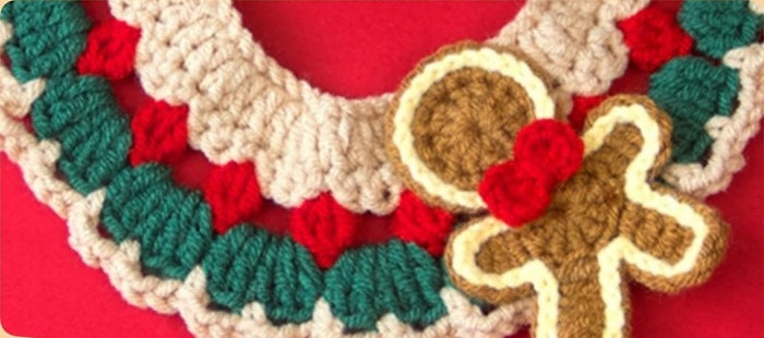 Close up of the crocheted gingerbread man and cookie on the collar