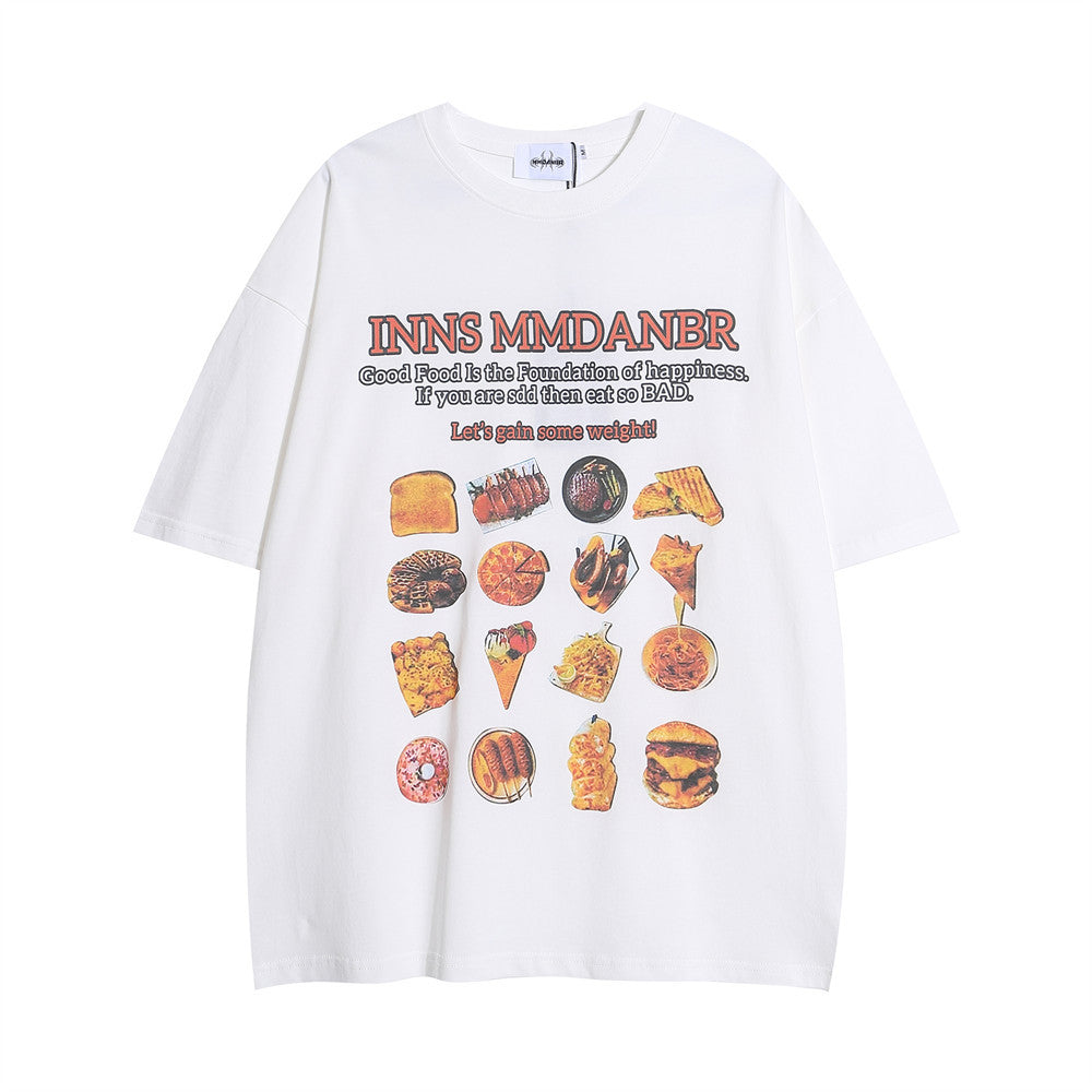 White T-shirt featuring a colourful BBQ food print and playful text, promoting a fun and vibrant food-themed style.