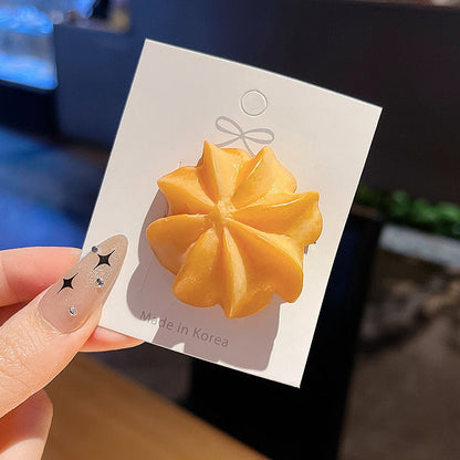 Flower cookie hair clip on its backing card