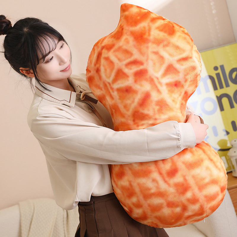 Cuddling the giant peanut plush pillow