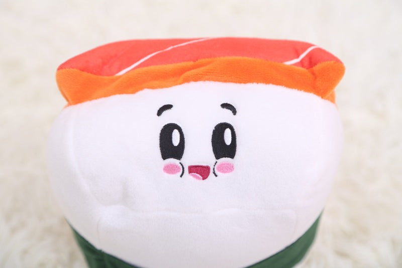 One plush toy with orange-red top, white rounded face, embroidered black eyes, pink cheeks, smiling mouth, ...