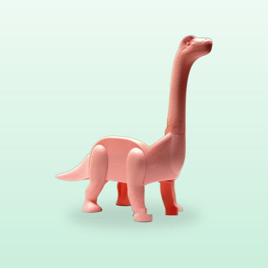 Pink dino taco holder, empty, side view on a mint background