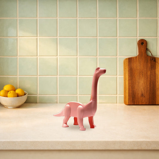 Pink dino taco holder on a kitchen worktop