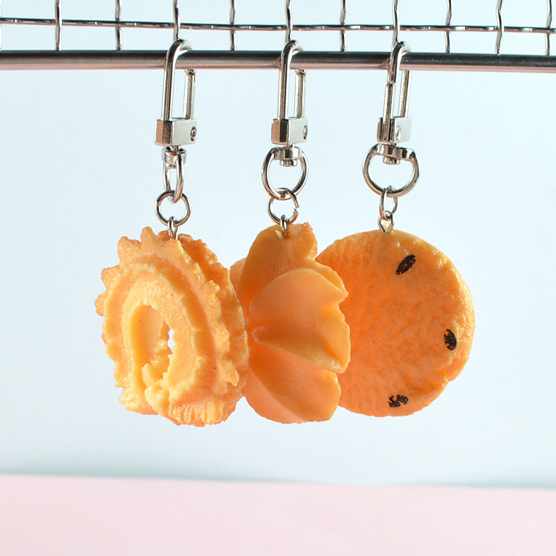 Three cookie keychains on swivel clasps: ring, star and choc chip