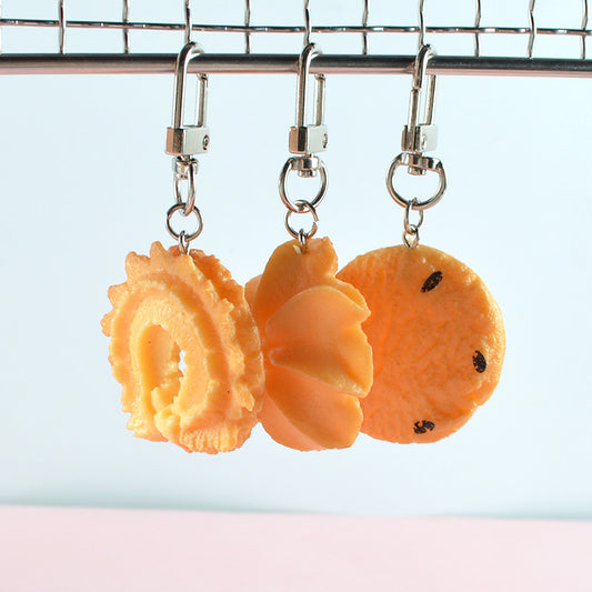 Three cookie keychains on swivel clasps: ring, star and choc chip