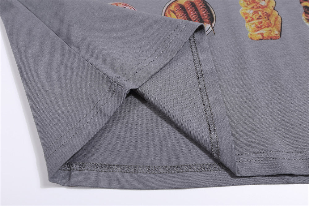 Grey T-shirt featuring vibrant BBQ food prints, showcasing burgers, sausages, and grilled meats on the fabric.