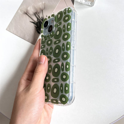 Hand holding one transparent iPhone case with repeating green kiwi slice pattern and clear bumper.
