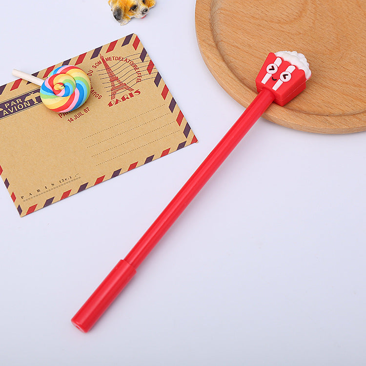 Red gel pen with a smiling popcorn box topper