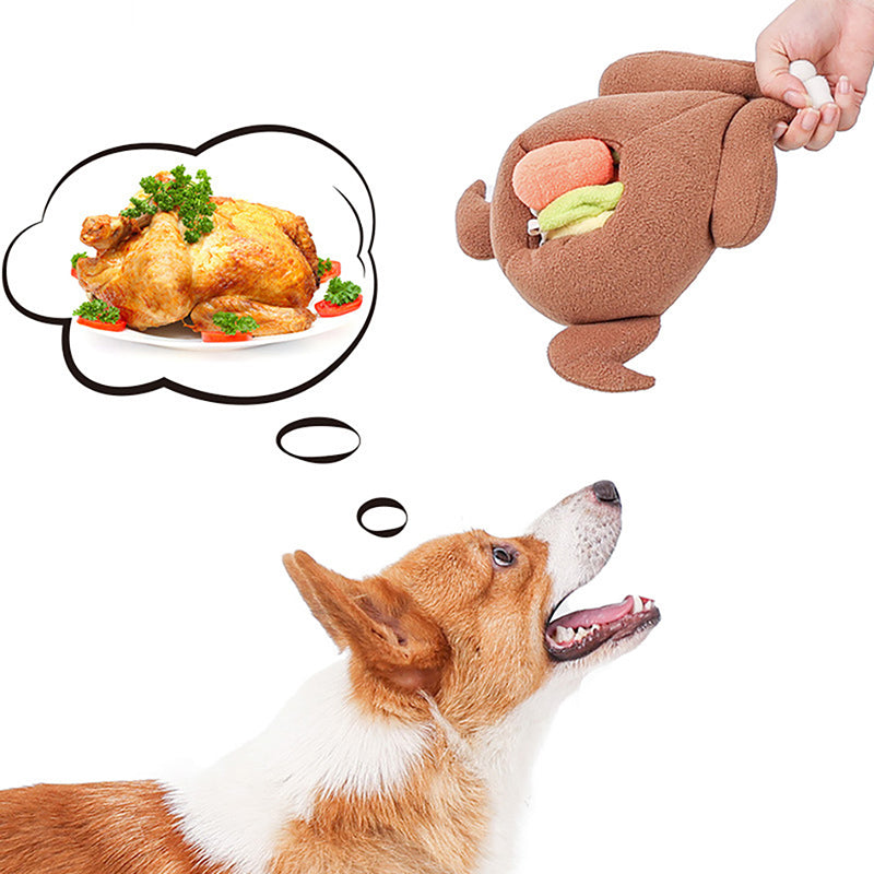 Corgi looking up at a hand-held brown plush roast toy with colored inserts and a thought-bubble roast chicken.