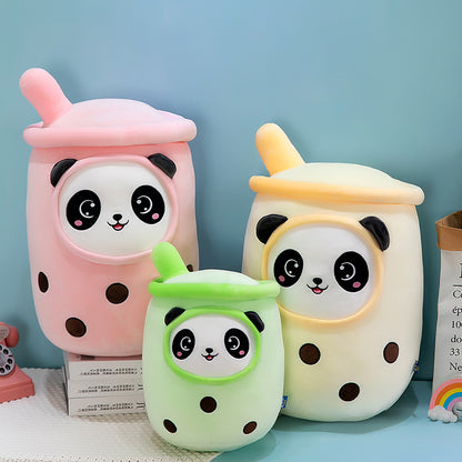 Three plush cup pillows (pink, cream, green) with panda faces, straw tops and brown boba dots.