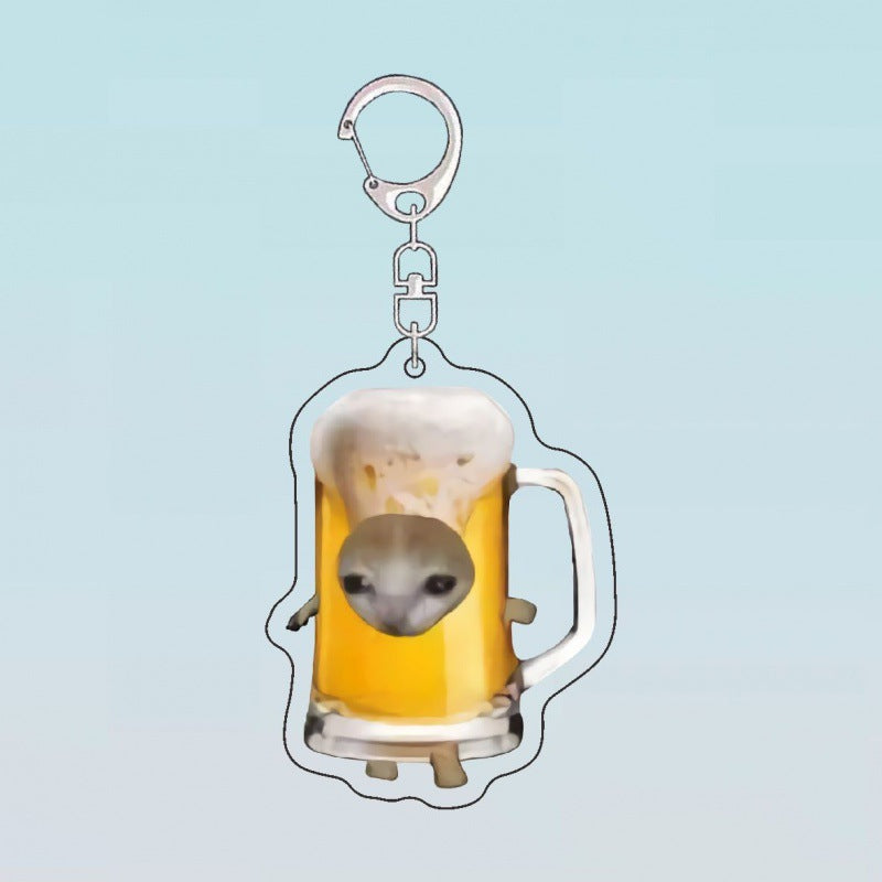 Kawaii keychain featuring a cute cat in a beer mug, with a frothy top and playful design.