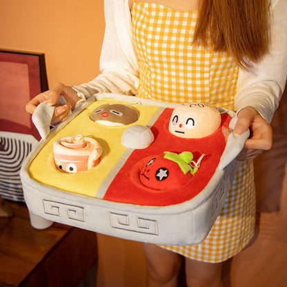 Hands holding the plush hot pot playset