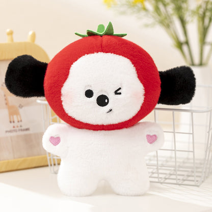 One white plush toy with a red tomato-like head, green leaf top, black ears, winking face, pink heart.