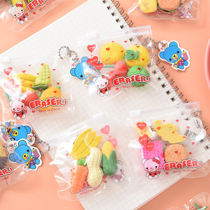 Six clear zip pouches holding colorful food-shaped erasers (banana, corn, peanut, cookie) and cartoon tags.