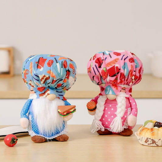 Two plush gnome dolls: one blue with white beard holding a sandwich, one pink with braids holding a burger.