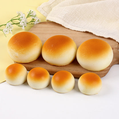 Row of golden bun squishies in two sizes