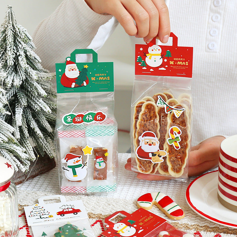 Two festive Christmas biscuit gift bags featuring adorable designs, one with Santa and the other with a snowman.