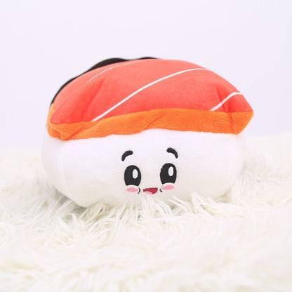 One plush sushi nigiri with orange-red fish top, white rice and embroidered black eyes, pink cheeks.