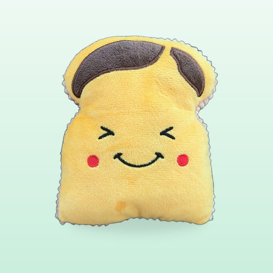 Yellow toast squeaky dog toy with a smiling face and rosy cheeks on a mint background