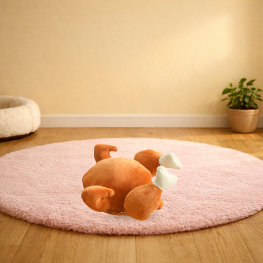 Roast turkey squeaky pet plush toy on a pink rug in a living room