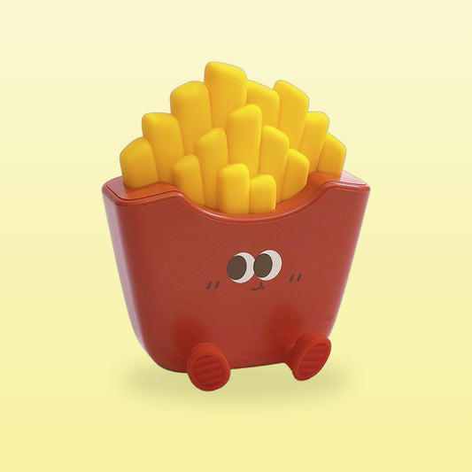 Red fries night lamp with a smiley face and little feet, on a butter yellow background