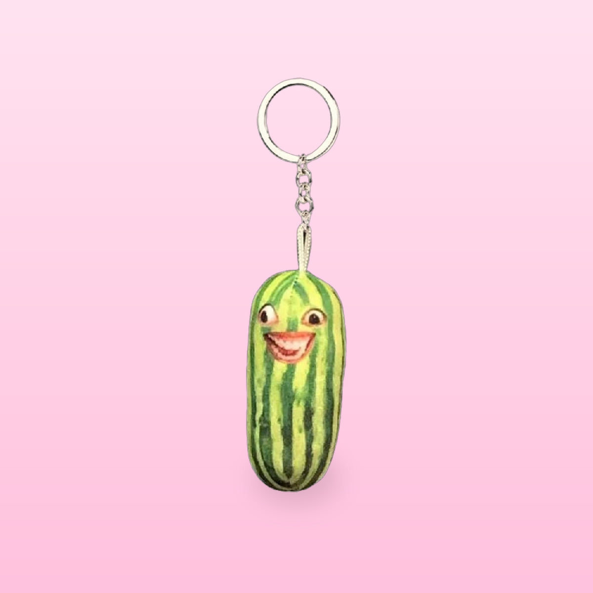 Grinning watermelon plush keychain with a silver keyring and chain, on a pink background