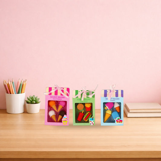 Three novelty eraser boxes in ice cream, fast food and sweet treats on a wooden desk
