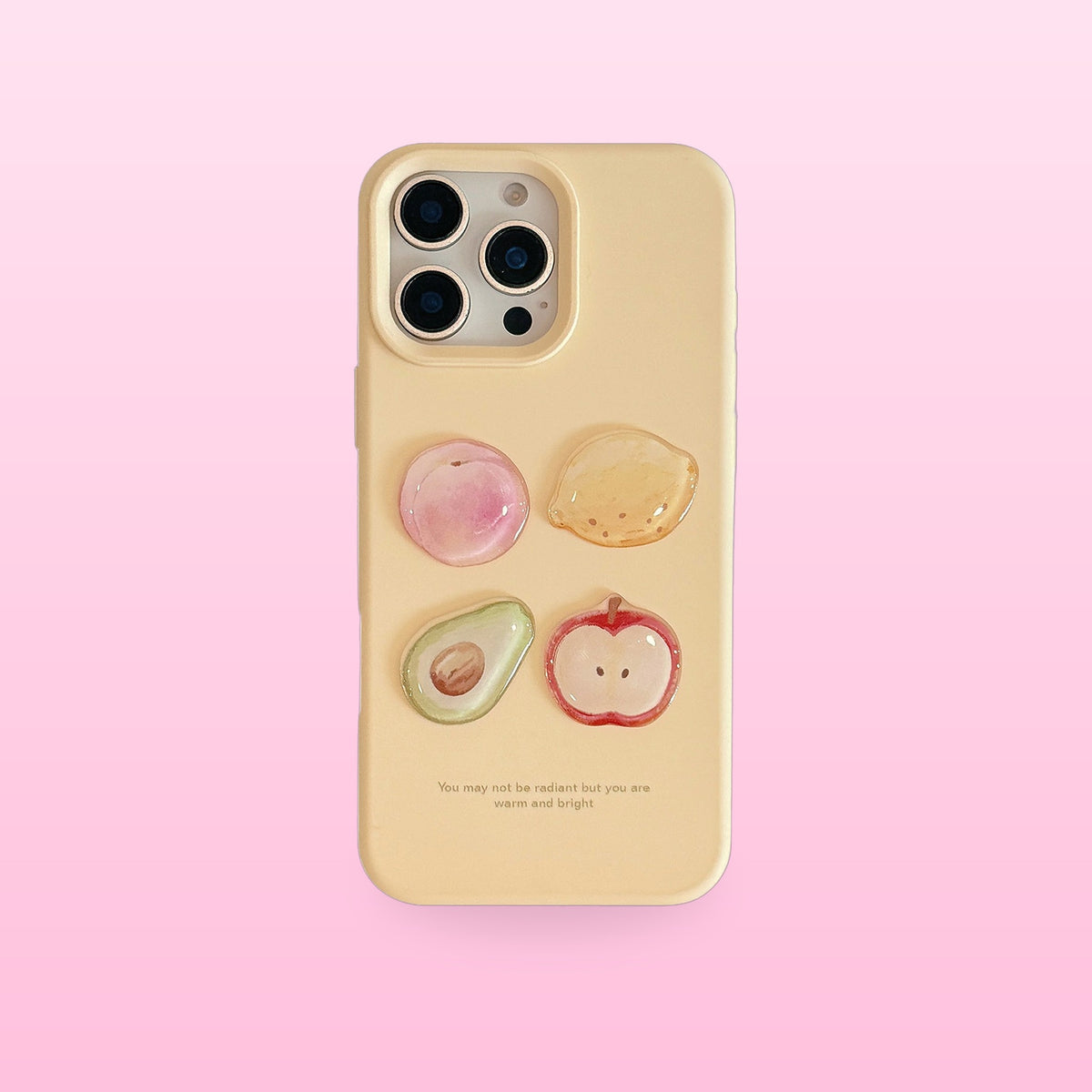 Cream yellow iPhone case with 3D peach, lemon, avocado and apple, back view, on a pink background