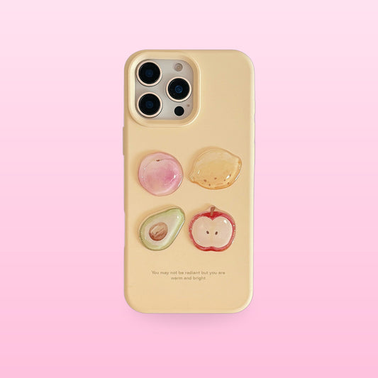 Cream yellow iPhone case with 3D peach, lemon, avocado and apple, back view, on a pink background