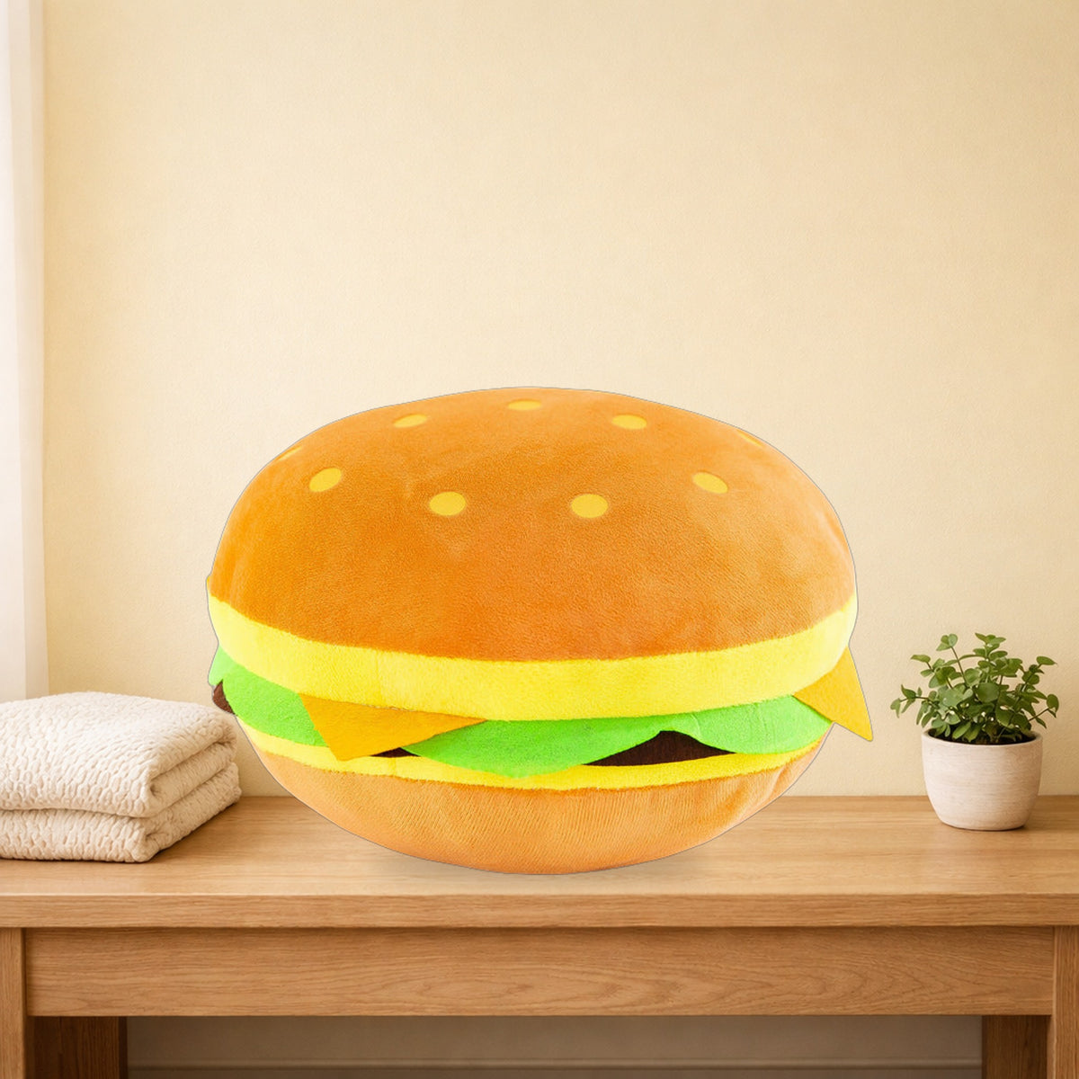 Cheeseburger plush pillow sitting on an oak bench in a pastel bedroom
