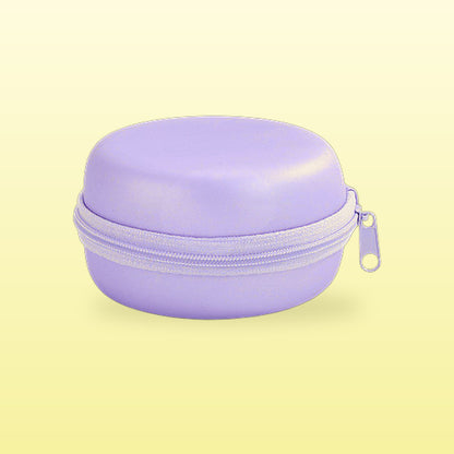 Lavender macaron travel jewellery case on a butter yellow background